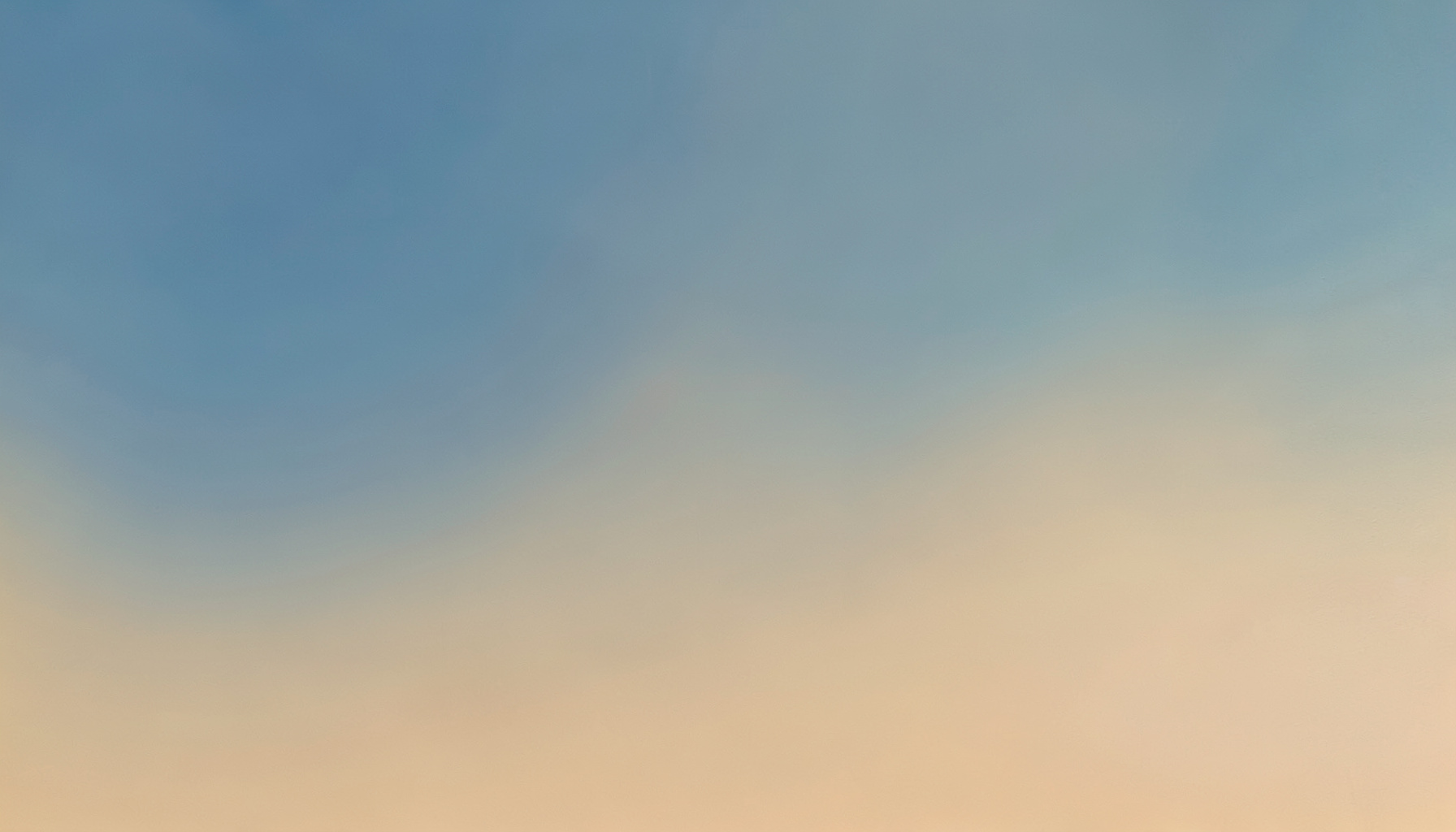 Abstract gradient composition in muted blue and warm sand tones, soft and atmospheric, no figures or objects